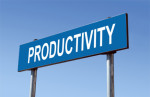 A sign with the word productivity written on it emphasizing that Standing Desks help a person become more productive.